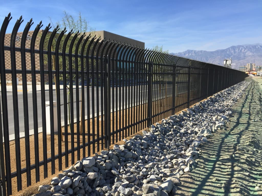 Steel palisade fence along a commercial property